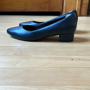 Black leather block heeled shoes.
